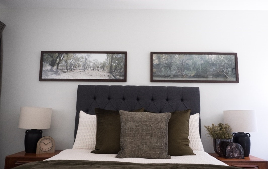 Image of two artwork hanging on wall at the Display Village at Whitlam.
